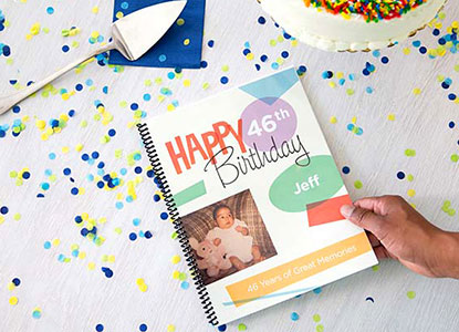 A printed birthday guestbook on a decorated table