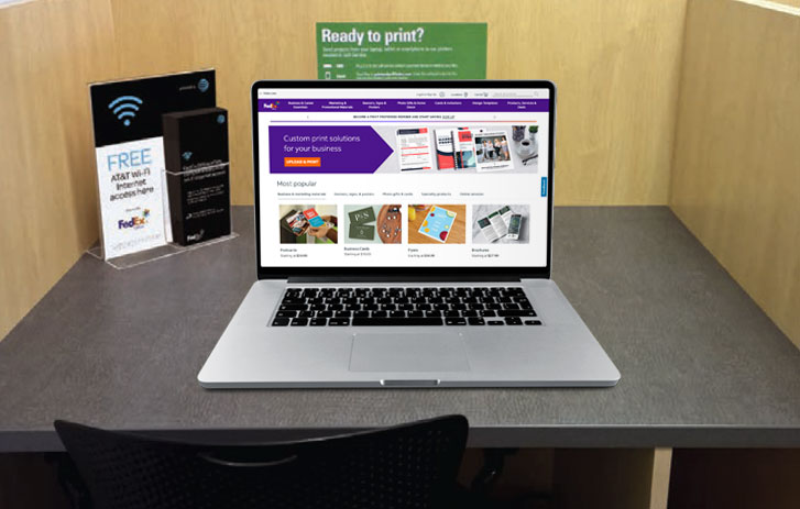 A laptop being used in a FedEx Office in-store for the free wifi network
