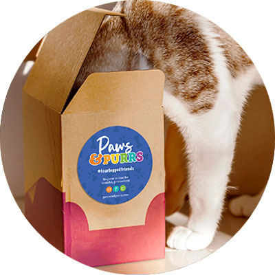 A promotional circle packaging label for a pet company on the outside of a package