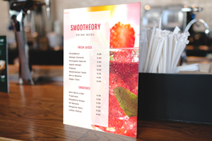 Smoothie drink menu displayed on a counter